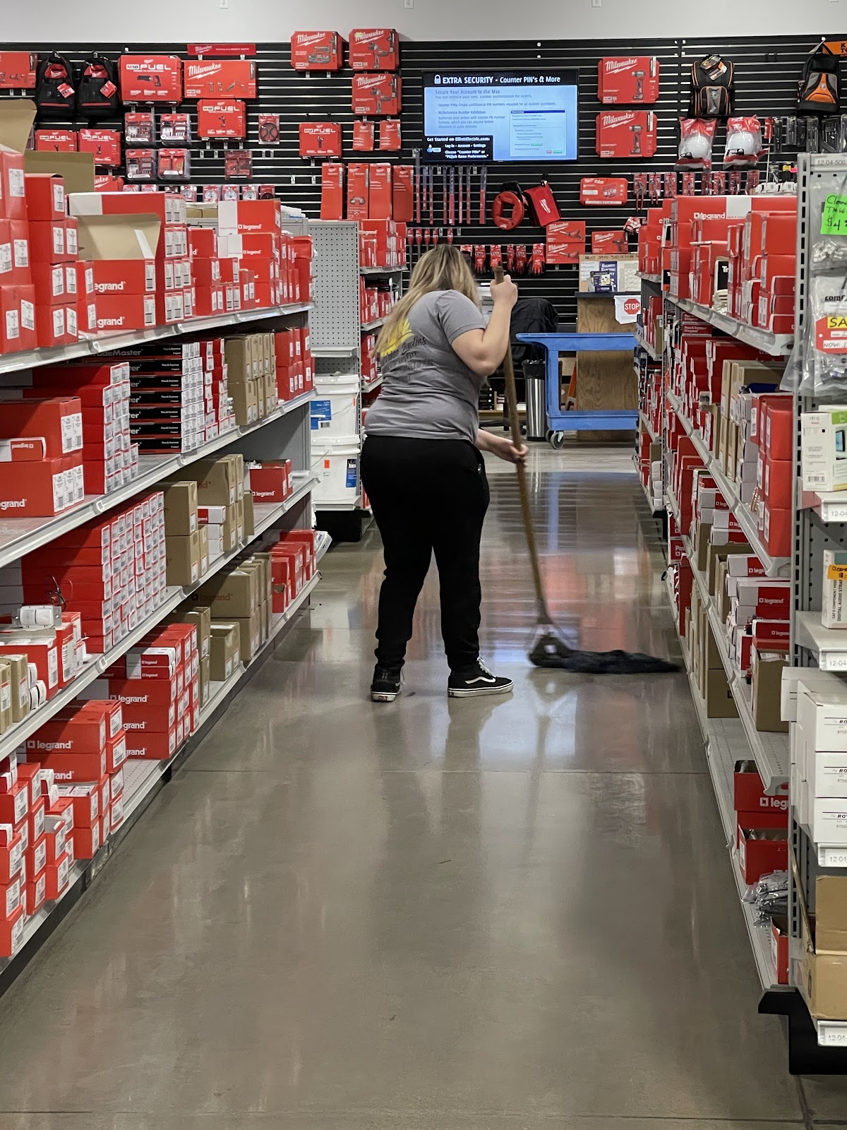 Sweeping the aisle of a store