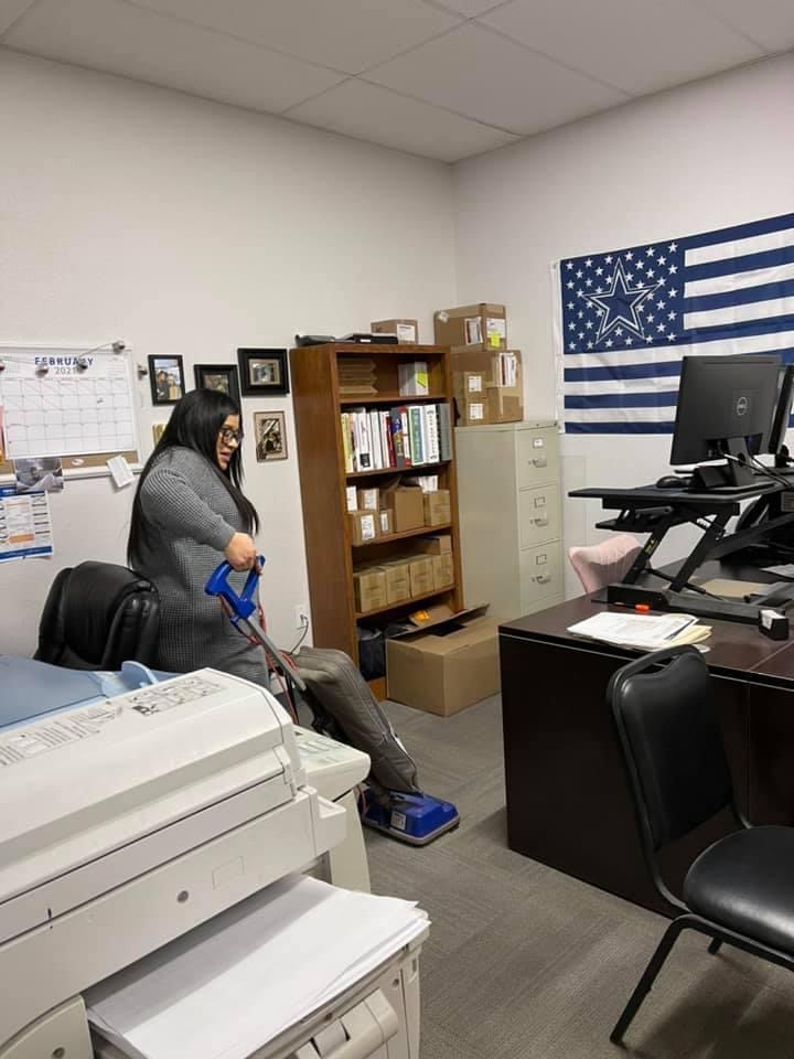 Vacuuming an office floor